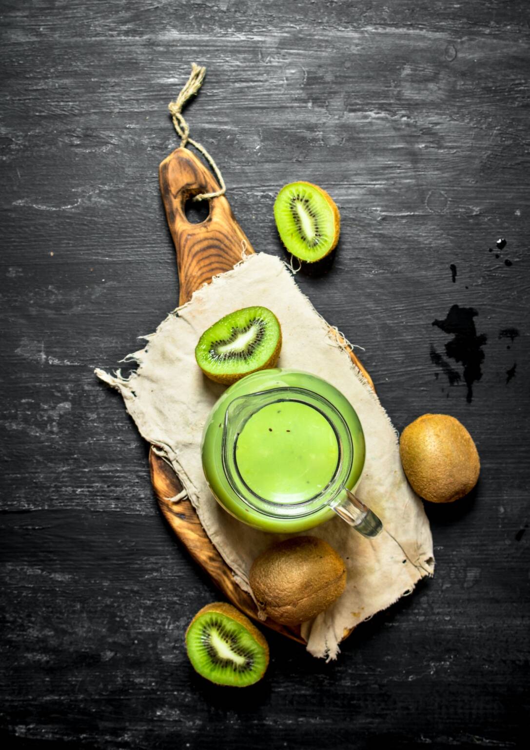 Fresh juice of kiwi in the pitcher.
